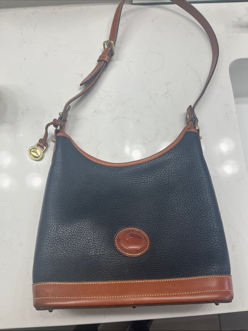 Dooney & Bourke Navy Pebbled Leather Shoulder Bag with Brown Trim
